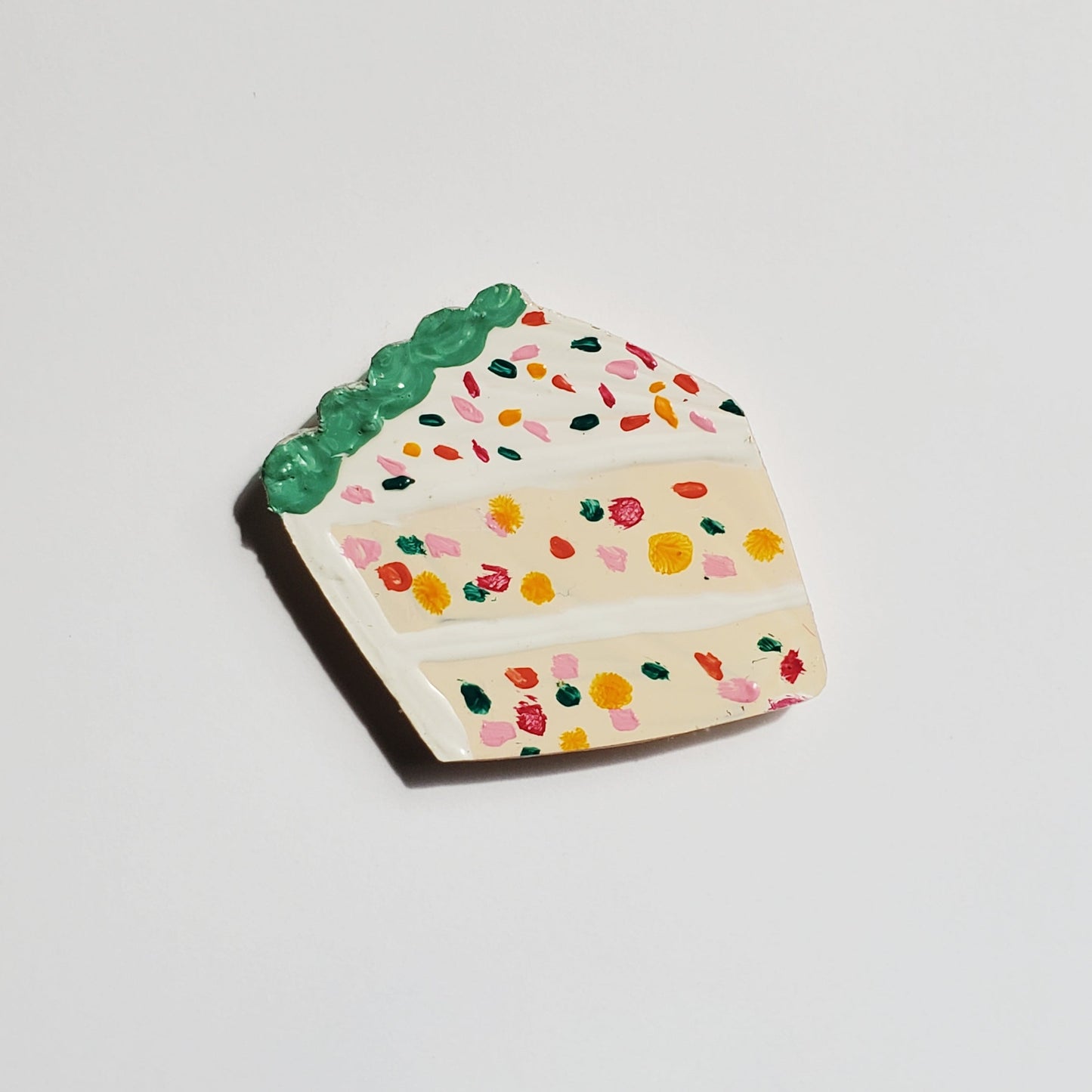 Decorative funfetti cake-shaped magnet with colorful sprinkles
